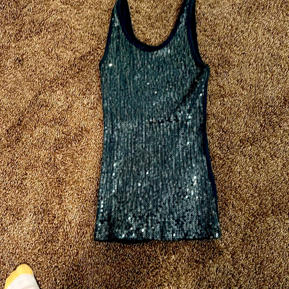 Tank top with sequins on front . Like new .